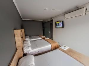 Voodi või voodid majutusasutuse Hotel Ruiseñor Itagui toas