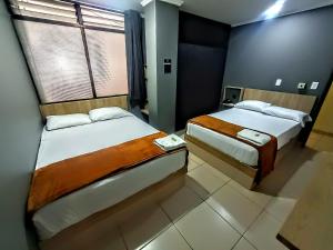 Voodi või voodid majutusasutuse Hotel Ruiseñor Itagui toas