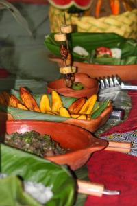 a plate of food on a table with vegetables at Amazon Nativo Lodge in San Pedro
