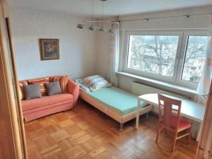 a living room with a couch and a table at Make yourself at home in Vaihingen an der Enz