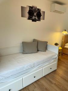 Postel nebo postele na pokoji v ubytování Apartmany Dolni Dunajovice