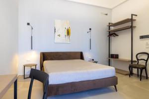 Letto o letti in una camera di Lucrezia Dimore - Ugento