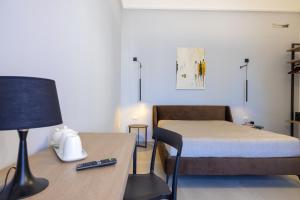 Letto o letti in una camera di Lucrezia Dimore - Ugento