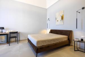 Letto o letti in una camera di Lucrezia Dimore - Ugento