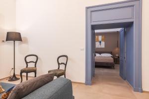 Letto o letti in una camera di Lucrezia Dimore - Ugento