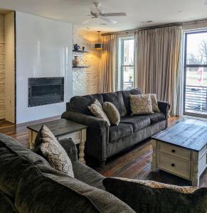 a living room with a couch and a table at Cherry Street Luxury Apartment in Helena