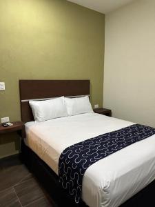Giường trong phòng chung tại REGMAR Progreso Yucatán