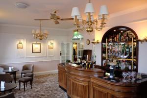 a bar in a restaurant with a lot of alcohol at The Crescent Hotel in Scarborough