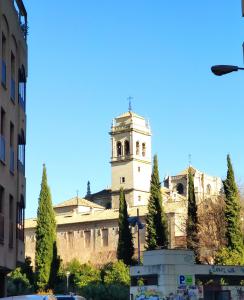 a building with a clock tower on top of it at Granada Home Center in Granada
