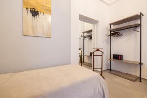 Letto o letti in una camera di Lucrezia Dimore - Ugento