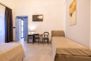 Letto o letti in una camera di Lucrezia Dimore - Ugento