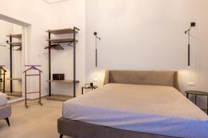 Letto o letti in una camera di Lucrezia Dimore - Ugento