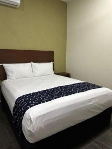 Giường trong phòng chung tại REGMAR Progreso Yucatán