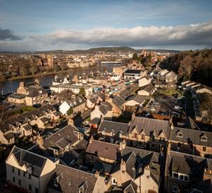 an aerial view of a city with houses and a river at The Tartan Terrace in Inverness