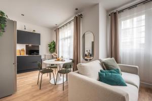 a living room with a couch and a table at Renovated Studio walking distance to Paris in Montrouge