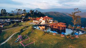 an aerial view of a resort with a water park at Hotel Reserva Monarca in Salento