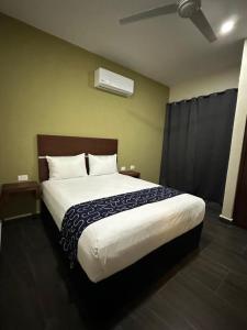 Giường trong phòng chung tại REGMAR Progreso Yucatán