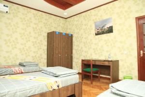 Postel nebo postele na pokoji v ubytování Yellow Hostel Dushanbe