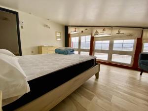 Ένα ή περισσότερα κρεβάτια σε δωμάτιο στο Auberge de Gros-Cap