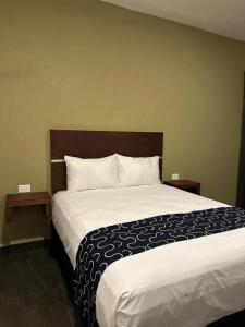 Giường trong phòng chung tại REGMAR Progreso Yucatán