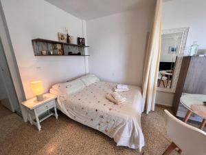 Postel nebo postele na pokoji v ubytování estudio El Faro