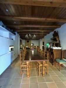 a dining room with a wooden table and chairs at Amazing villa for big groups in the best place of Costa Brava in Palamós