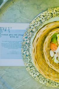 a plate of spaghetti and vegetables on a table at Lazzlla beachside studio apartments in Hulhumale +19 photos