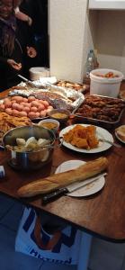 a table with many different types of food on it at Britannia Hôtel Cmr in Yaoundé