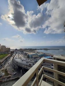 a view from a balcony of a city with traffic at Discover Inn in Alexandria