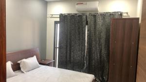 Ένα ή περισσότερα κρεβάτια σε δωμάτιο στο Aqua view Bijilo +3 φωτογραφίες