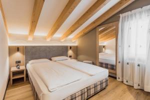 Postel nebo postele na pokoji v ubytování Suàn Hotel