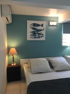 Letto o letti in una camera di Appartement style Caribeen
