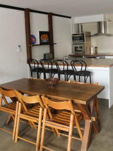 a wooden table and chairs in a kitchen at Large Modern 3BR 2 BATH Apt for Big Groups in Fyshwick