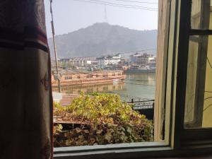 a window with a view of a body of water at Lake Boulevard Guest House in Durgjan