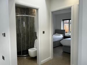 a bathroom with a shower and a toilet in a room at Prospect View in Portstewart