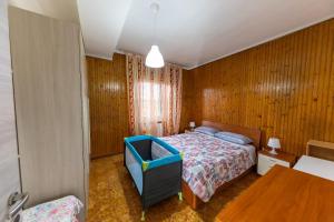 מיטה או מיטות בחדר ב-Affittibreviferrera Appartamento Ilenia