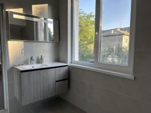 a bathroom with a sink and a window at Комплекс Маджарово in Madzharovo +37 photos