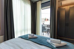 Кровать или кровати в номере Trinity Hotel