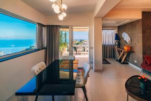 a dining room with a view of the ocean at Taormina Seaview - Luxury Apartment in Taormina in Taormina