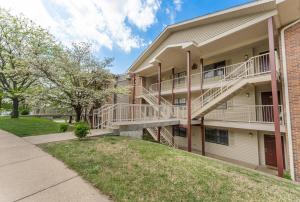 a apartment building with stairs and a sidewalk at Free Daily Attractions including Silver Dollar City! Spacious, Centrally located, 2 pools in Branson