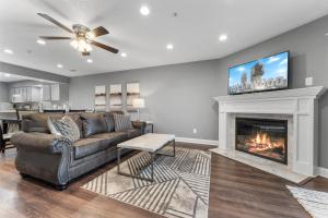 a living room with a couch and a fireplace at Free Daily Attractions including Silver Dollar City! Spacious, Centrally located, 2 pools in Branson