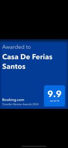 תעודה, פרס, שלט או מסמך אחר המוצג ב-Casa De Ferias Santos