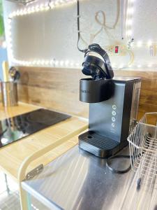 a microscope sitting on top of a kitchen counter at Work, Rest and Play: WiFi, TV and Backyard Bliss in North Miami Beach