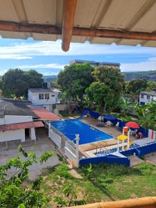 a view of a swimming pool from a building at Hotel santa marta Melgar in Melgar