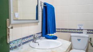 a bathroom with a sink and a toilet at HOTEL KAISER in Sousse