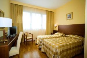Posteľ alebo postele v izbe v ubytovaní Hotel Marconi