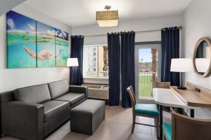 a living room with a couch and a desk at La Copa Inn Beach Hotel in South Padre Island