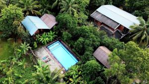 an overhead view of a house with a swimming pool at Sun and Green Eco Lodge - Dambulla in Dambulla