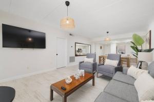 a living room with a couch and a table at Enjoy the Best Ocean Views in a Beach Front Condo in South Padre Island