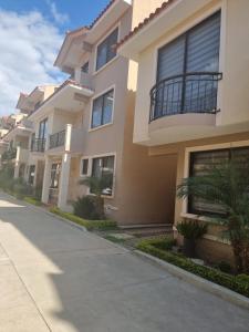 a row of houses on a street at Comodidad y Elegancia in Cochabamba